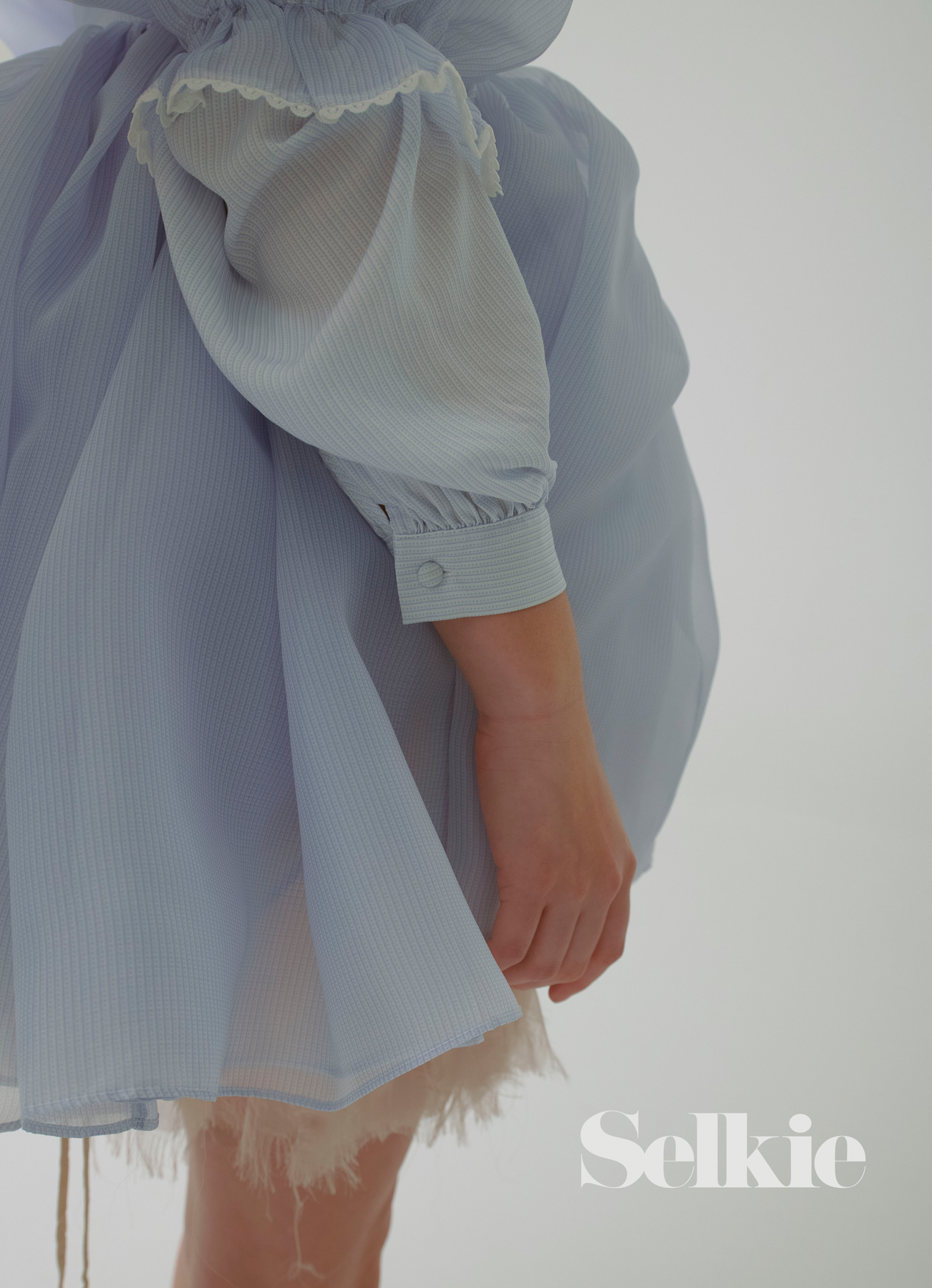 This pretty little pinstripe blouse made from 100% rayon is cool to the touch and looks beautiful worn buttoned up or down.